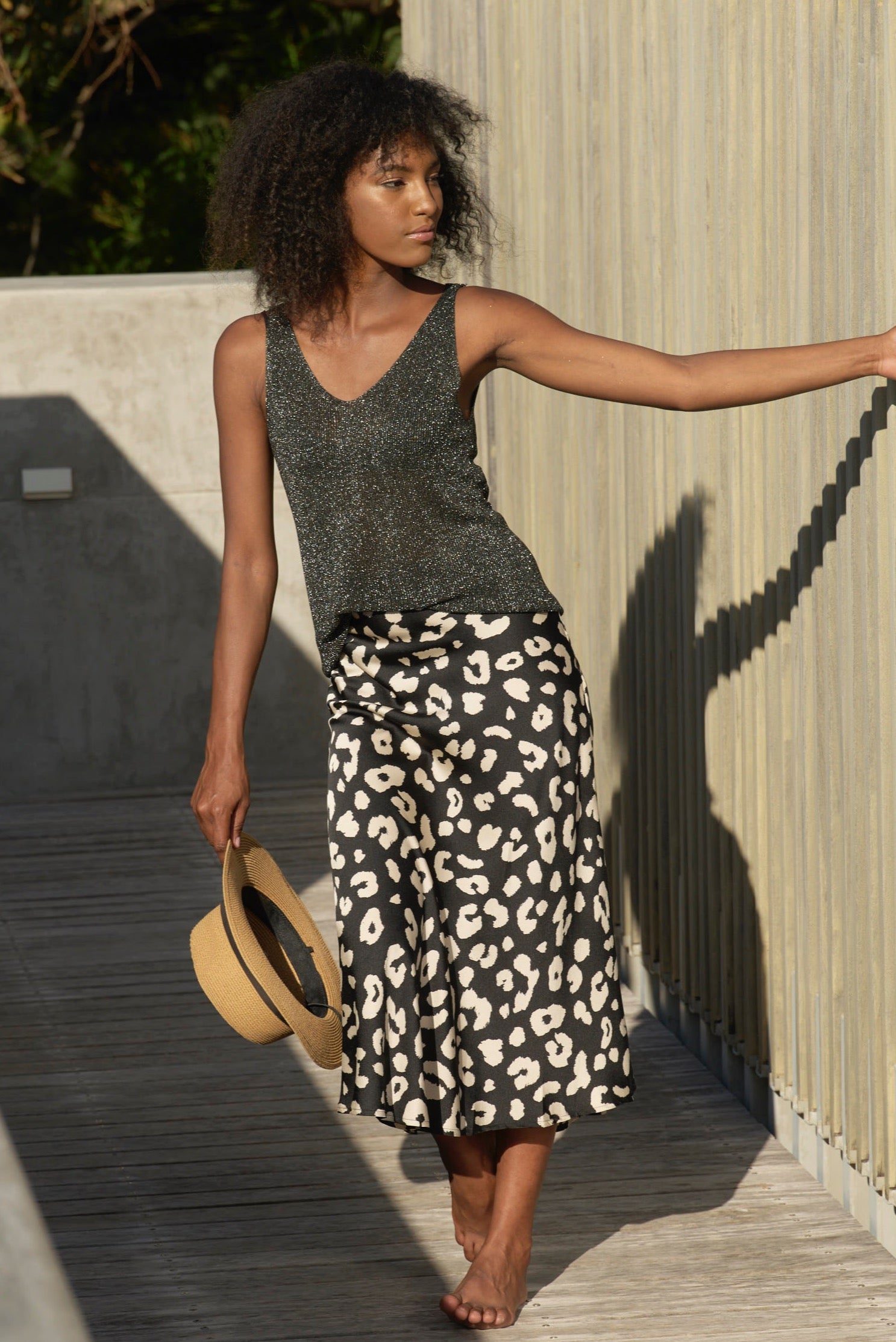 Leopard print skirt and black top best sale